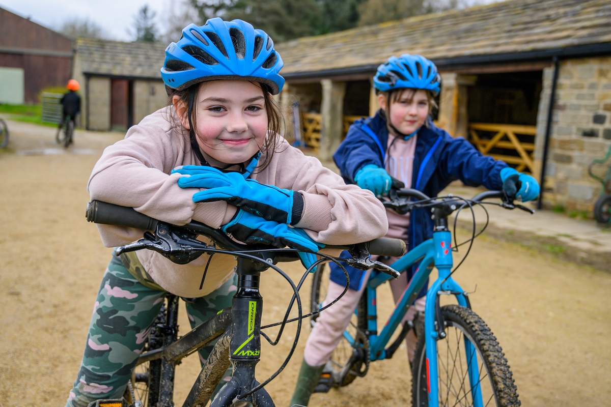 two girls riding bikes